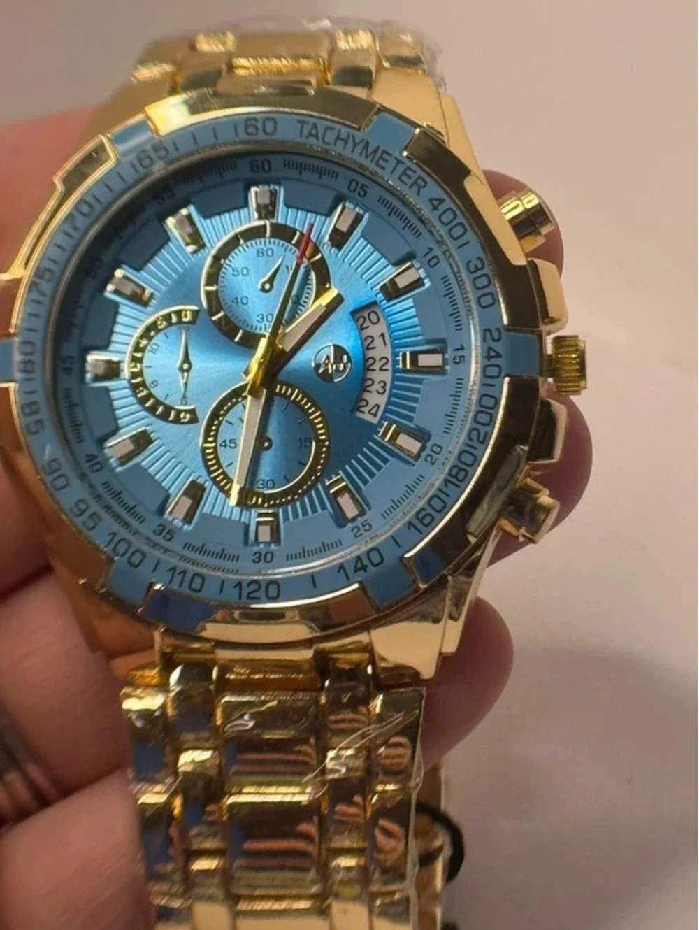 AJ heavy stainless steel, gold tone, blue face Sports Master
